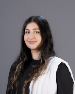 Head and shoulders picture of Aleena Khan, a woman with long dark hair